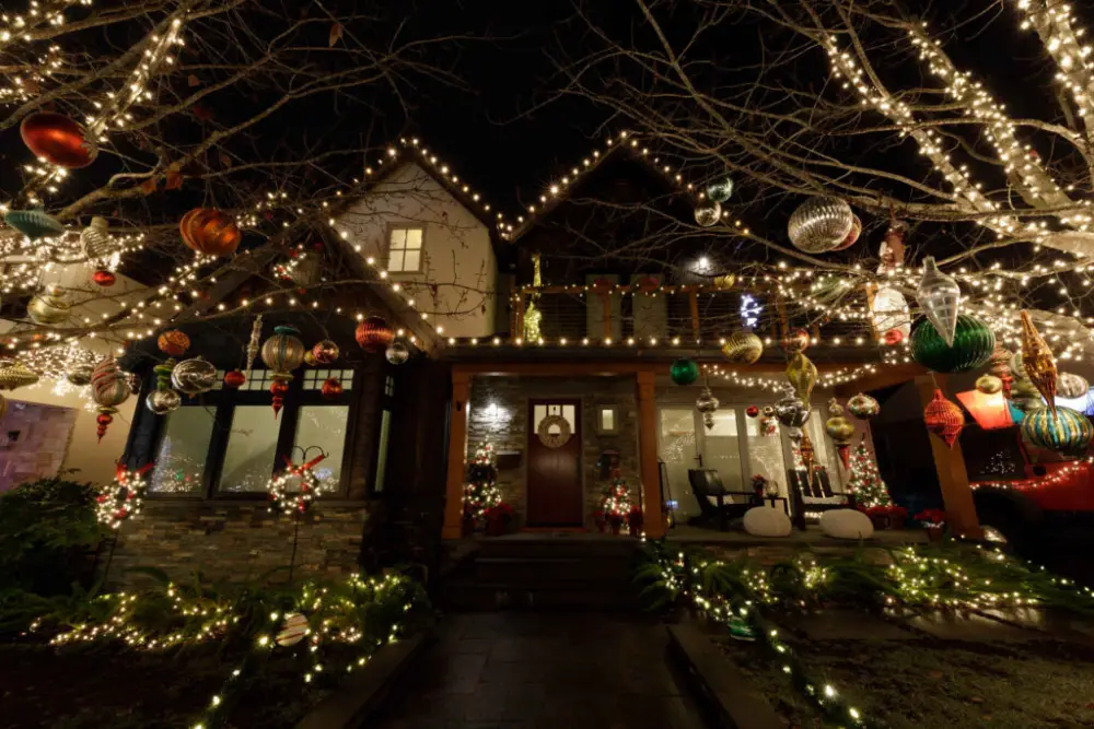 A home decorated with festive holiday lighting and ornaments.